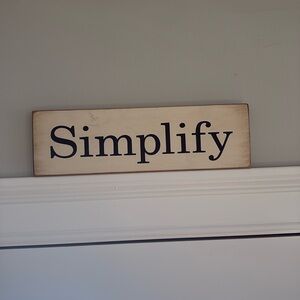 Wooden “Simplify” sign